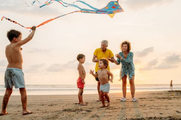 istock Grandfather playing with grandchildren 1364762082