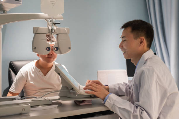 istock Ophthalmologist is using instrument to examine patient's eyes 1364762166
