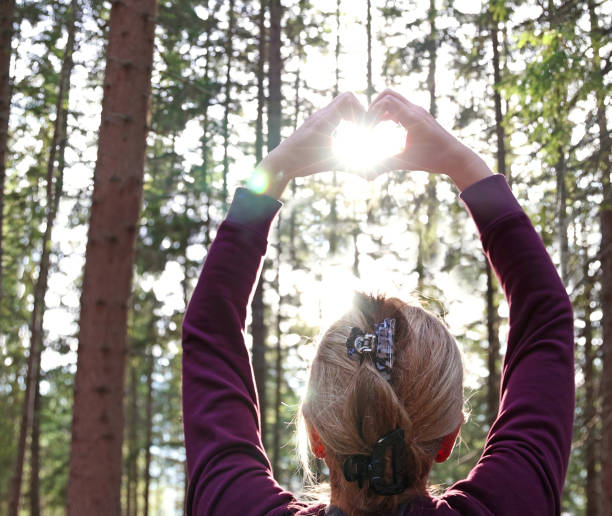 istock Female hands in shape of love heart 1364762500