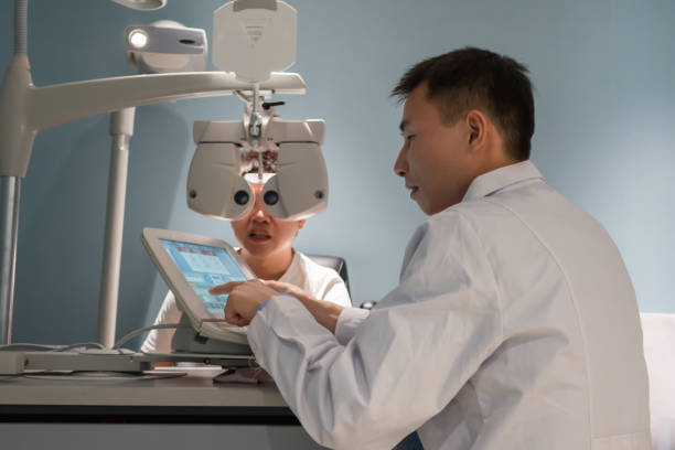 istock Ophthalmologist is using instrument to examine patient's eyes 1364762508