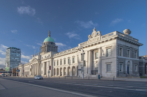 Custom House in Dublin in beautiful sunny day with blue skies above, Dublin Docklands in pandemium covid-19 with empties streets around,  Ireland