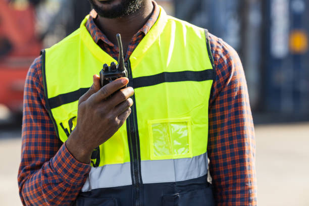 istock closeup worker using ham radio for operation control in cargo port shipping 1364766821