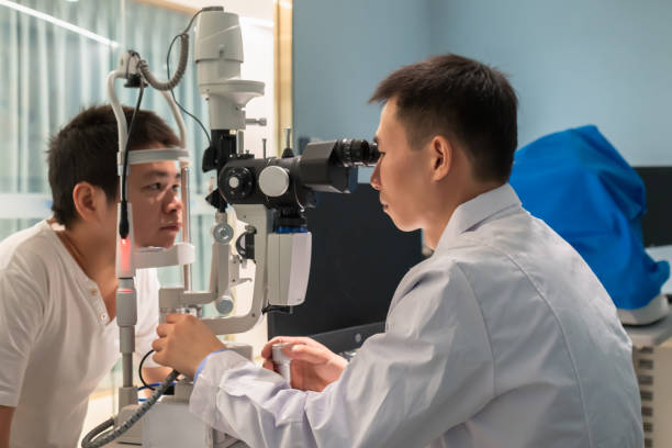 istock Ophthalmologist is using instrument to examine patient's eyes 1364767863