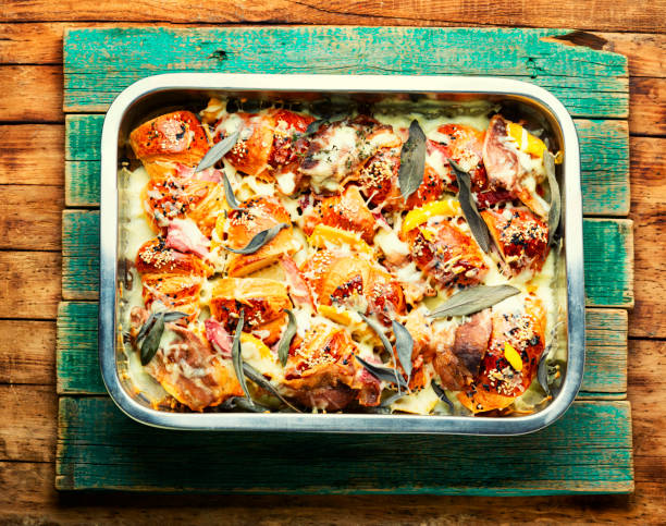 istock Croissant with baked ham baked with herbs. 1364767919