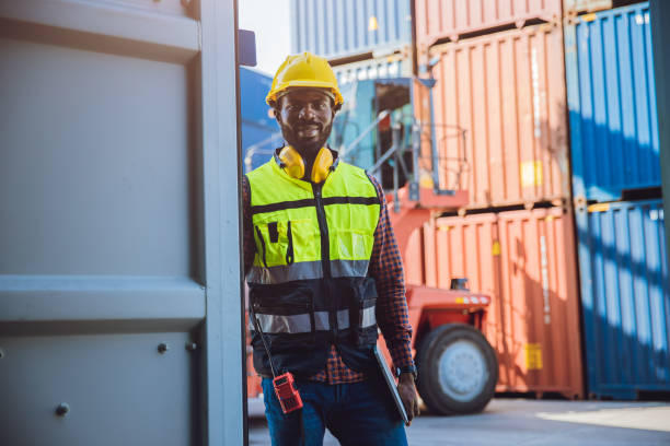 istock Portrait custom staff worker happy smile working in cargo shipping logistic port. 1364768155