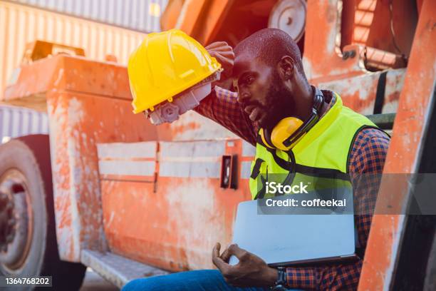 Tired Stress Worker Sweat From Hot Weather In Summer Working In Port Goods Cargo Shipping Logistic Ground Black African Race People Stock Photo - Download Image Now