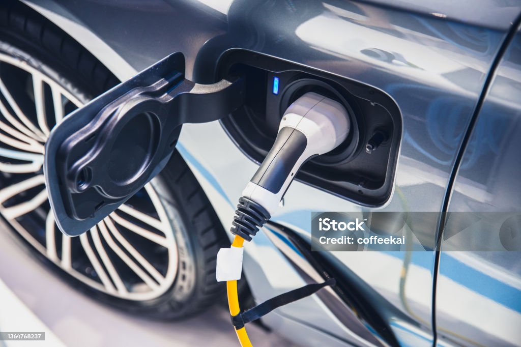 charging EV car electric vehicle clean energy for driving future Electric Vehicle Stock Photo