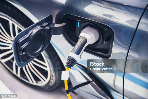 Charging Ev Car Electric Vehicle Clean Energy For Driving Future Stock Photo - Download Image Now