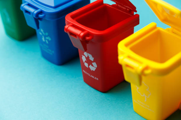 Dumpsters close-up. Container for disposal garbage waste and save environment. Yellow, red, blue and green dustbins for recycle. The concept of ecology. Separate garbage collection