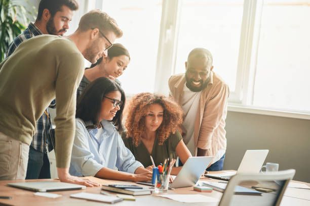 istock Friendly young people showing support to their office colleague 1364780618