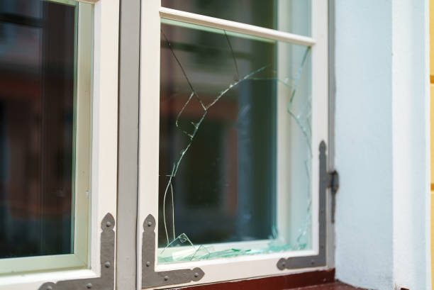 istock Broken window in the house. Vandalism and pogroms. 1364781895