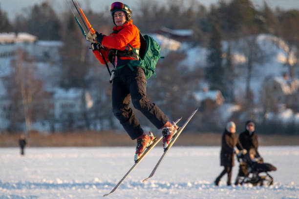 stockholm sweden januari - 11 - 2022 - an unknown man goes kitesurfing on a lake called drevviken but for the city of stockholm in tyresö municipality
