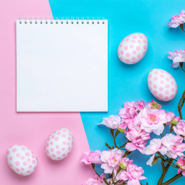 istock Easter background with polka dot paschal eggs, pastel pink paper template, greeting card with copy space for text. Spring season. Festive flat lay, mockup. Layout, flower frame border. View from above 1364787384