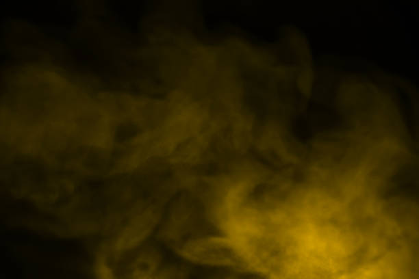 żółto-złoty dym parowy - multiple exposure exploding colors color image zdjęcia i obrazy z banku zdjęć