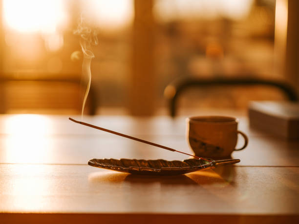 istock Burning Incense indoors in morning sunshine with coffee cup 1364790178