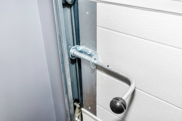 istock Manual spring latch from the home garage door, visible guides from the gate. 1364790289