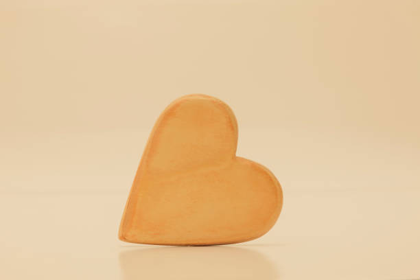 Wooden heart exposed on a light background
