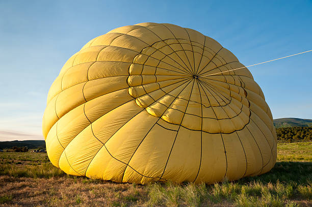 istock Yellow Hot Air Balloon Being Inflated 136479344