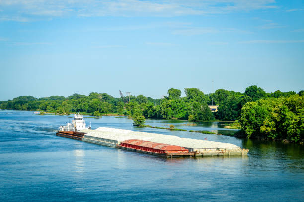 istock Aerial view of cargo ship in transit, river 1364796517