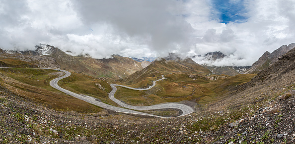 Col du Galibier, France - September 20, 2021: Panoramic view of the Col du Galibier mountain in the French Alps and the serpentine road