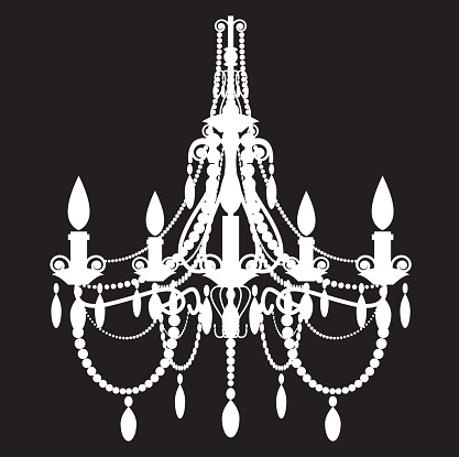 A fancy white chandelier on a black background.