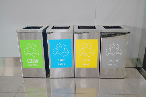 Colored rubbish containers for separate sorting of garbage. Sorting a trash can or bags of different colors