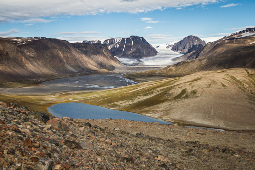 Retreating glaciers during sunny day in summer captured in Ringhornsdalen on Svalbard