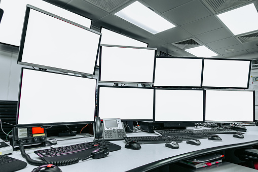 group of blank monitors and screen on security desk or control room for monitor process or stock data trading.