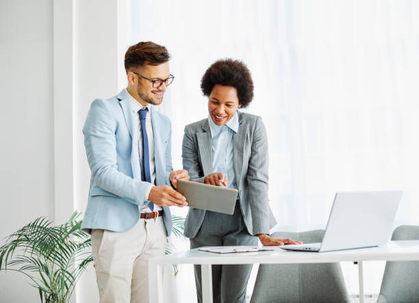 istock young business people meeting office teamwork group success corporate discussion tablet document 1364804087