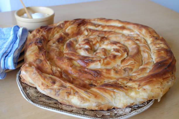 istock Traditional Serbian rolled cheese pie on a plate 1364811568