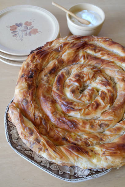 istock Traditional Serbian rolled cheese pie on a plate 1364811654