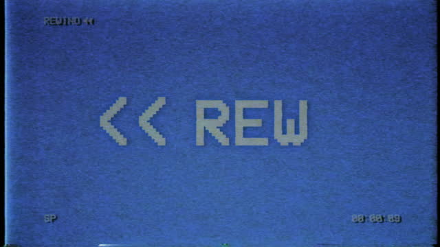 VHS video tape rewind process with on-screen symbol