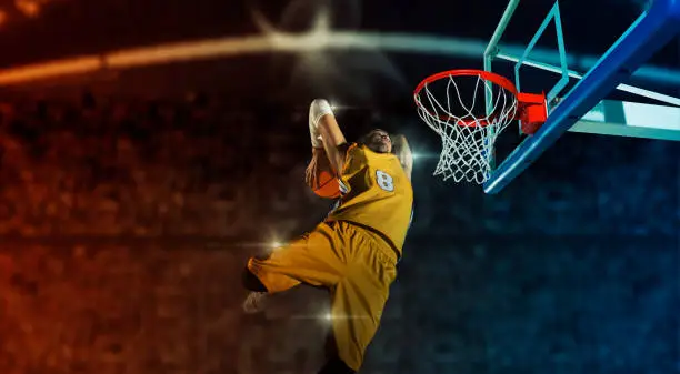 Basketball player players in action on arena background. Matte image