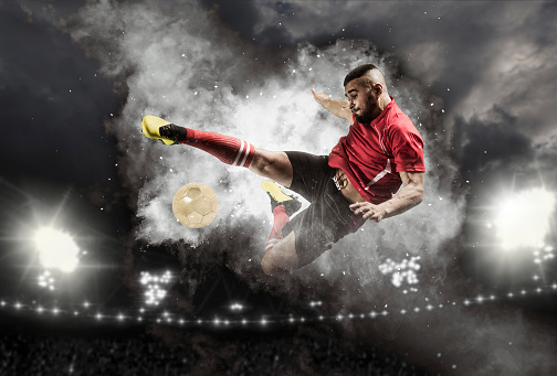 Soccer player in action on smoke background. Sports banner. Copy space background