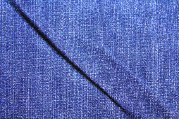 istock Denim. Crumpled blue jeans. Close-up. Background. Texture. 1364816643