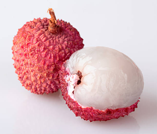 istock Peeled lychees and peeled lychees, isolated on a white background. 1364817788
