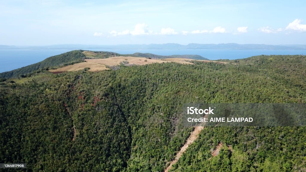 Breathtaking mountain view Vast area of upland farming and potential for ecotourism development on the top of these mountains in my home island. Aerial View Stock Photo