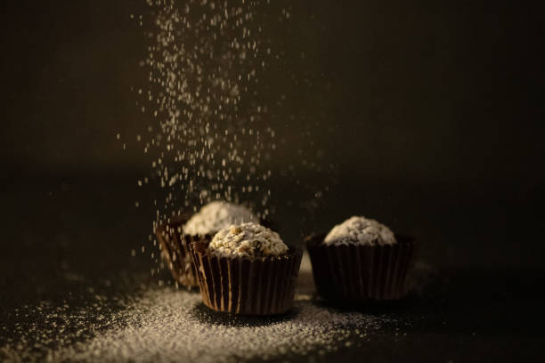 istock Home made sweets with powdered sugar on black background 1364821412