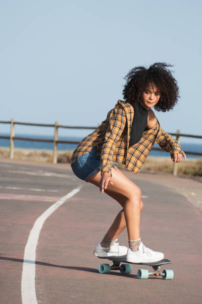 istock Young woman on skateboard 1364821676