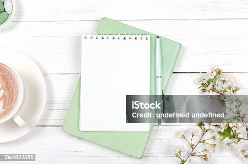 istock Creative flat lay of workspace desk, notepad on wooden background 1364822585