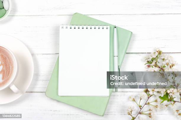 Creative Flat Lay Of Workspace Desk Notepad On Wooden Background Stock Photo - Download Image Now