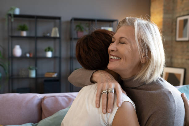 istock Women greeting each other at home 1364824093