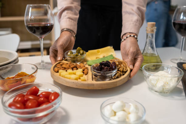 istock Woman serving appetizers on the table 1364824117