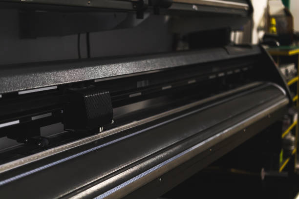 istock Modern plotter laser cutter machine in print house industry, close-up view photo 1364829819