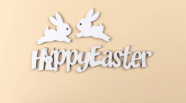 istock Happy Easter text, holiday postcard and celebration background with decoration rabbits, flat lay and top view photo 1364829881