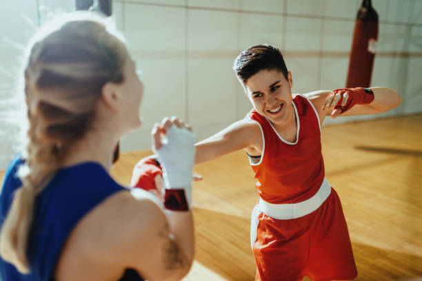 istock Strong and determined women boxing, warming up and shadow boxing 1364830603