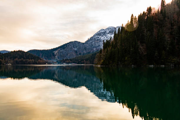 istock Landscape background - sunset over a mountain lake. 1364831619