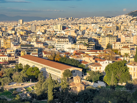 View of dense cityscape of Athens in Greece with Mount Lycabettus during sunset