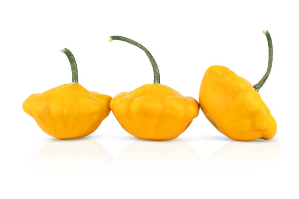 istock Three yellow patissons are isolated on a white background 1364834327