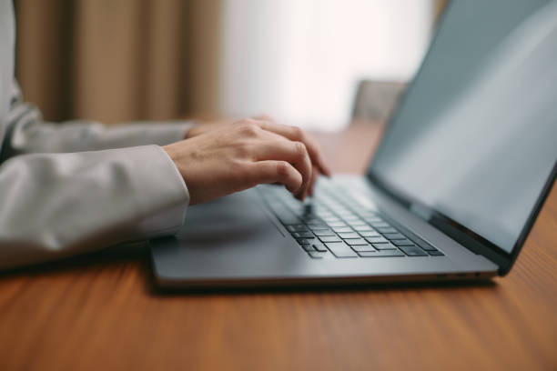 istock Close up woman work on modern computer typing on laptop keyboard, study online. Technology and e-learning 1364835283